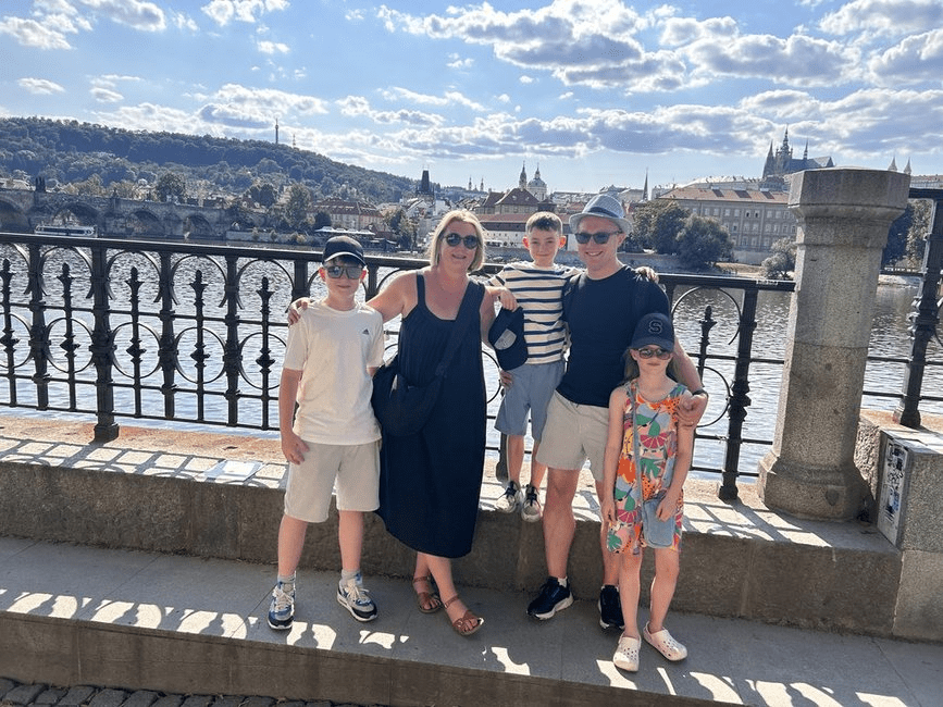 Murtagh family pose in front of the Vlatava River